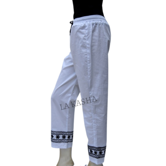 Pants in cotton poplin with all round elastic drawstring and handwork