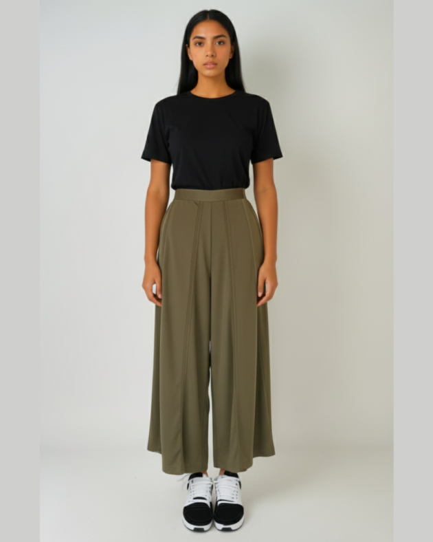 Front view of model wearing olive wide-leg stretch poly-knit comfort pants with black t-shirt.