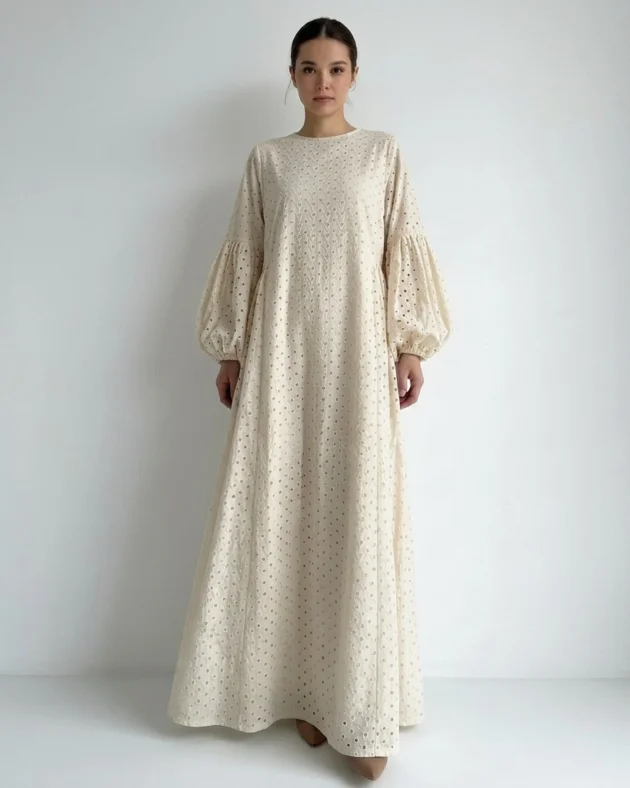 Ivory cotton eyelet maxi abaya dress by LA KASHA featuring delicate embroidery, a flowing silhouette, breathable fabric, and a fully lined interior.