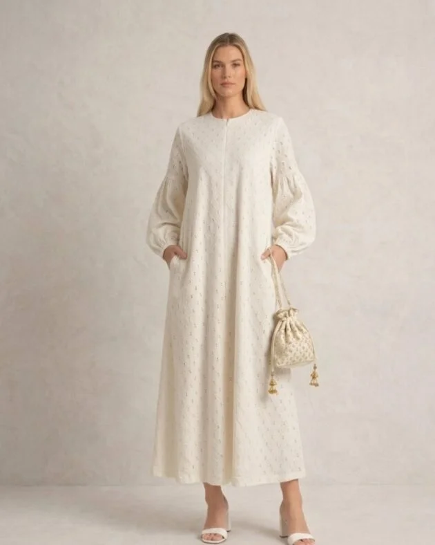 LA KASHA cotton eyelet embroidered maxi abaya dress featuring delicate embroidery, a relaxed silhouette, breathable fabric, and a fully lined interior.